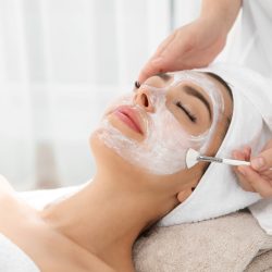 Cosmetologist,Applying,Mask,On,Client’s,Face,In,Spa,Salon Cosmetologist,Applying,Mask,On,Client's,Face,In,Spa,Salon