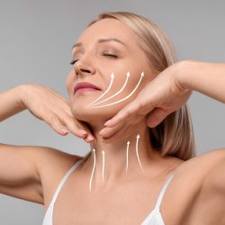 Woman,With,Perfect,Skin,After,Cosmetic,Treatment,On,Grey,Background. Woman,With,Perfect,Skin,After,Cosmetic,Treatment,On,Grey,Background.